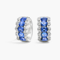 East-West Oval Cut Blue Sapphire and Pave Diamond Hoop Earrings In White Gold / Yellow Gold
