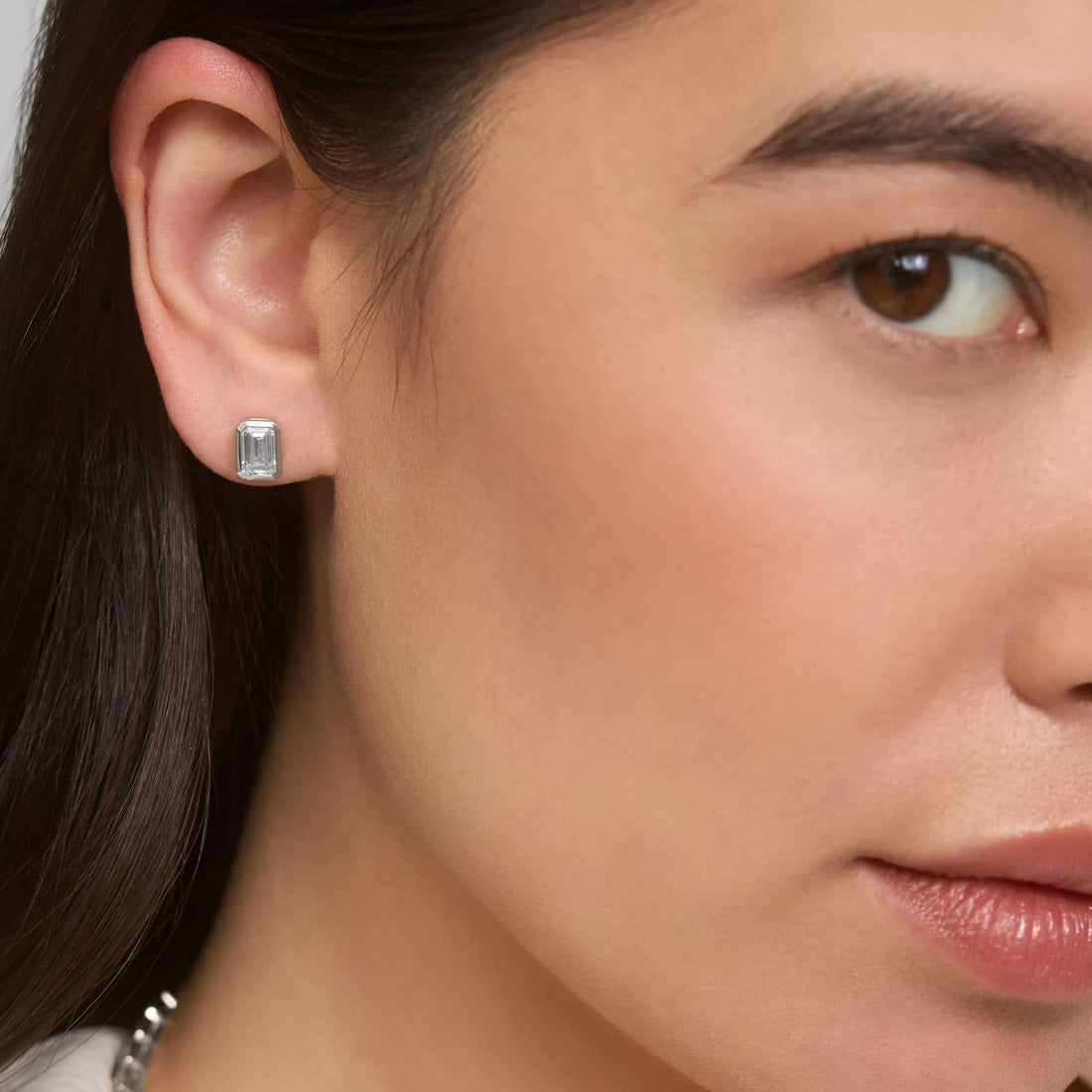 Bezel Set Emerald Cut Lab-Grown Diamond Stud Earrings In White Gold