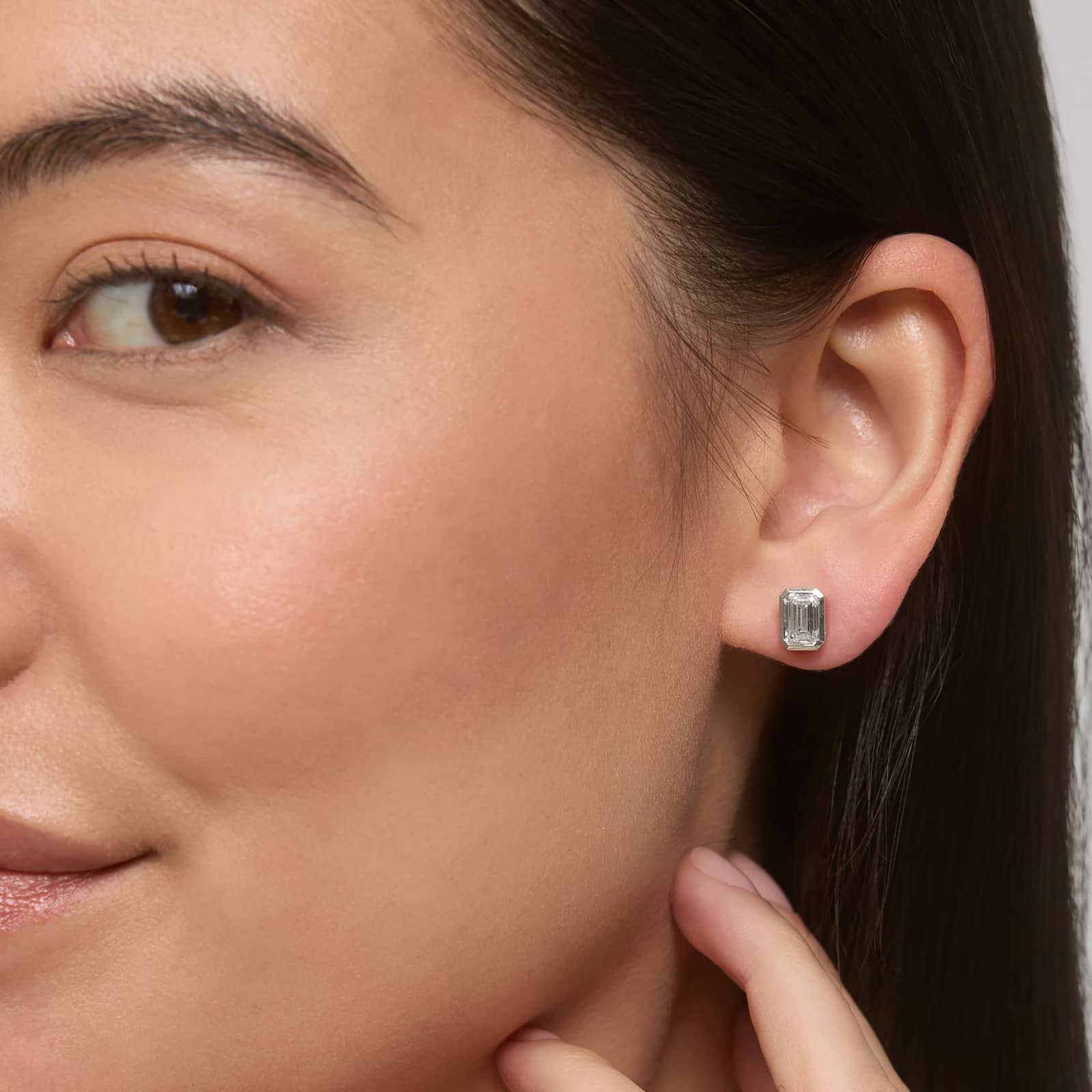 Bezel Set Emerald Cut Lab-Grown Diamond Stud Earrings In White Gold