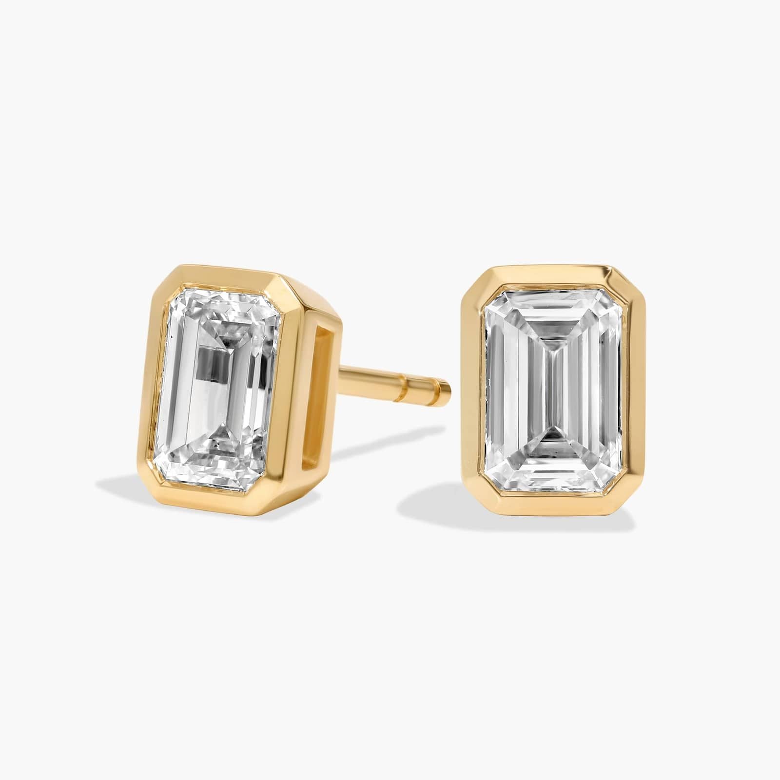 Bezel Set Emerald Cut Lab-Grown Diamond Stud Earrings In White Gold