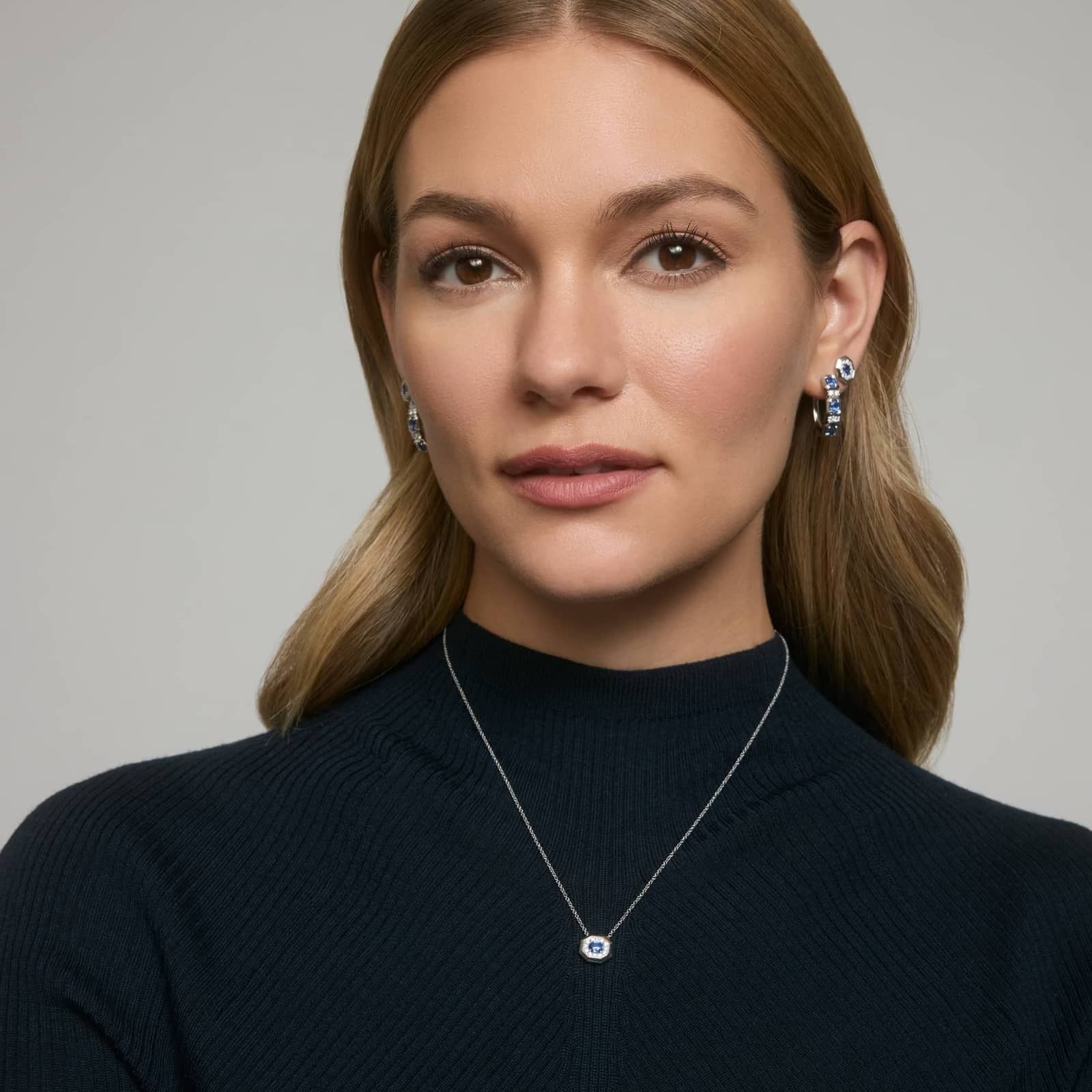 Oval Cut Blue Sapphire and Diamond Hoop Earrings In White & Yellow Gold