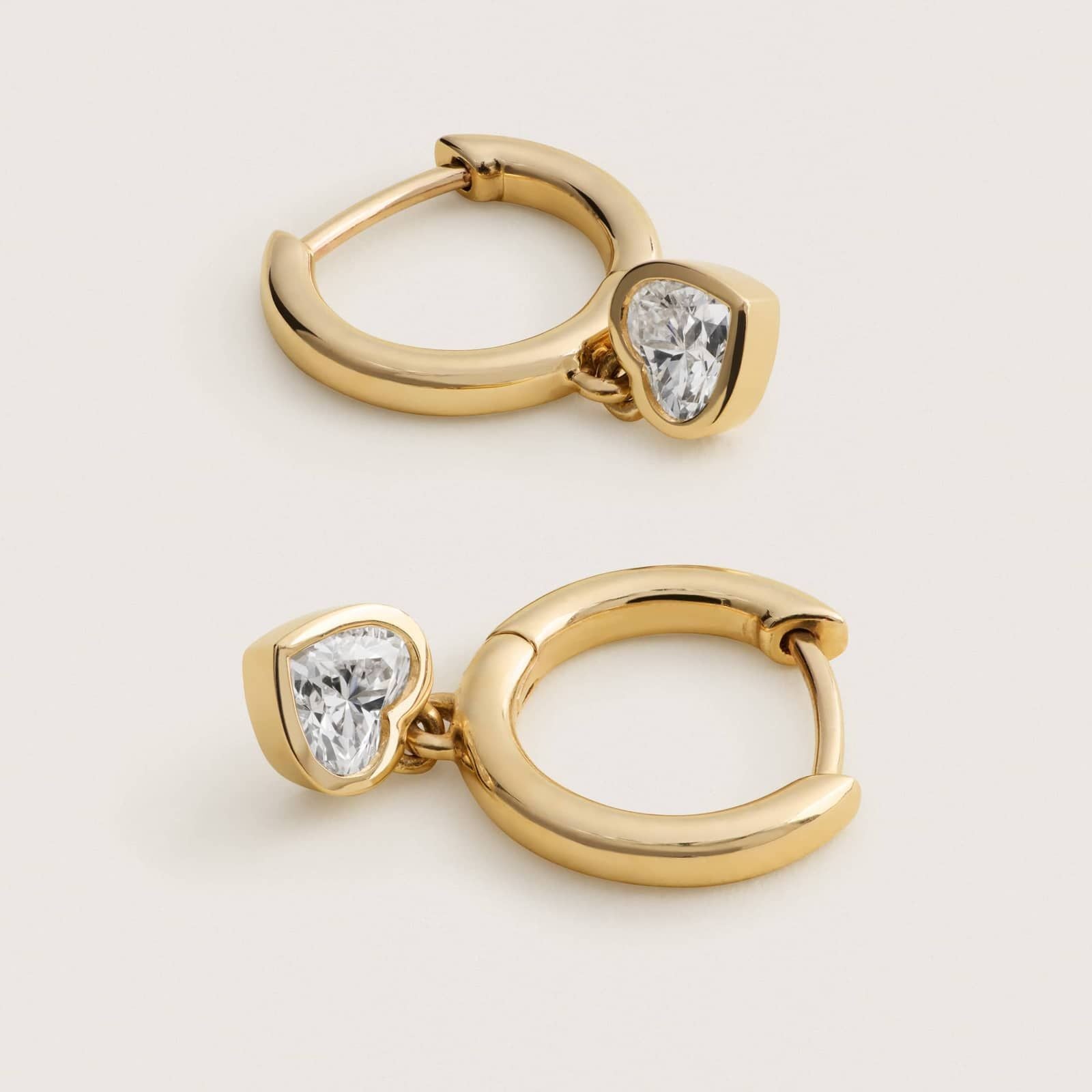 Heart Diamond Bezel Drop Huggie Earrings in White & Yellow Gold