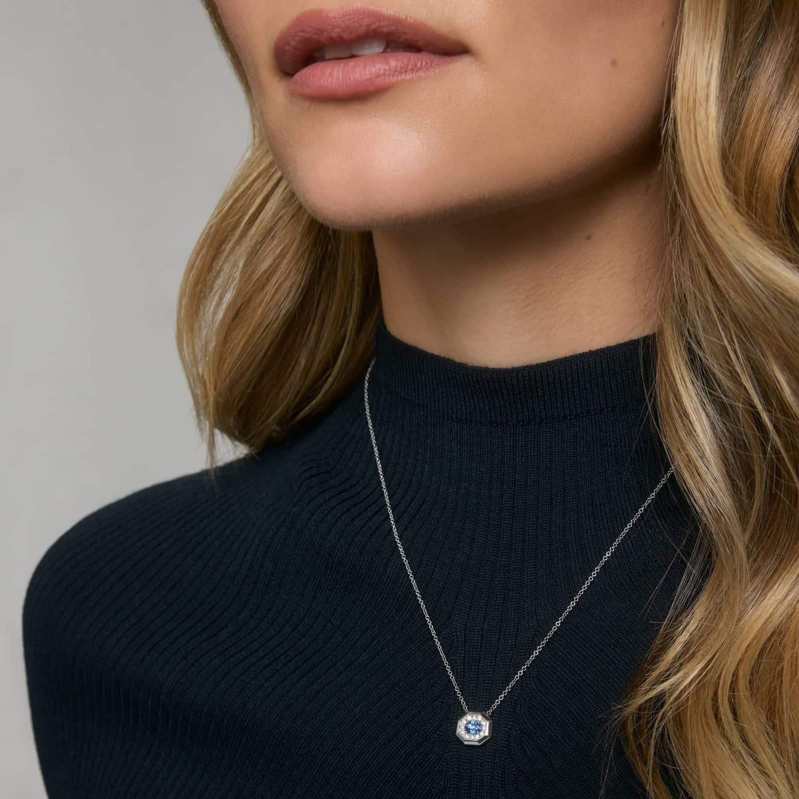 Oval Cut Blue Sapphire and Pave Diamond Pendant Necklace In White Gold