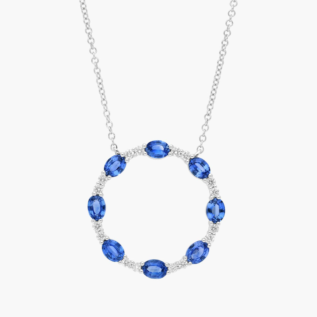 Oval Cut Blue Sapphire and Diamond Circle Pendant Necklace In White Gold / Yellow Gold