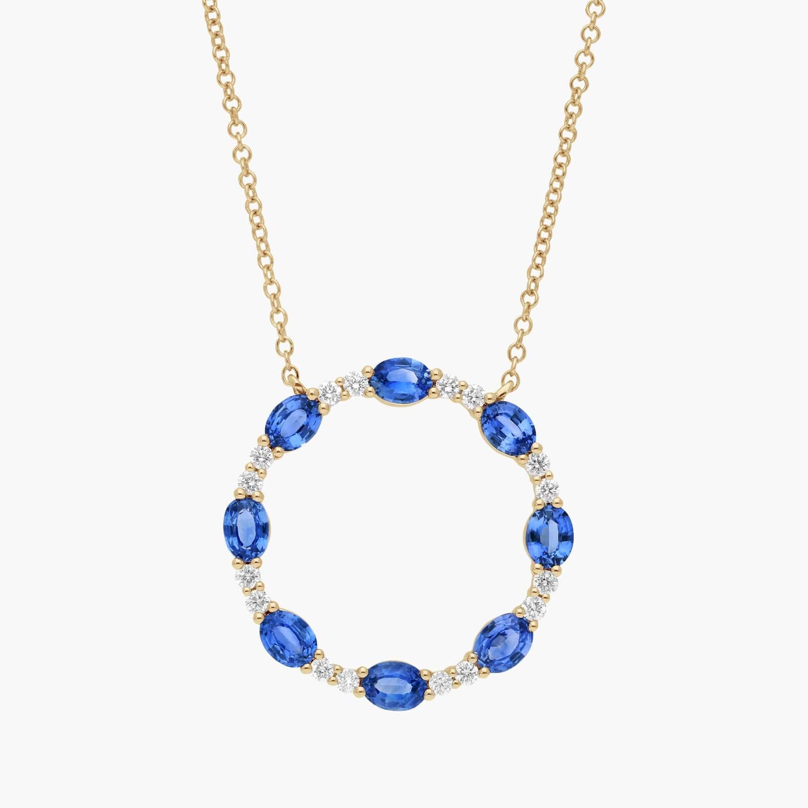 Oval Cut Blue Sapphire and Diamond Circle Pendant Necklace In White Gold / Yellow Gold