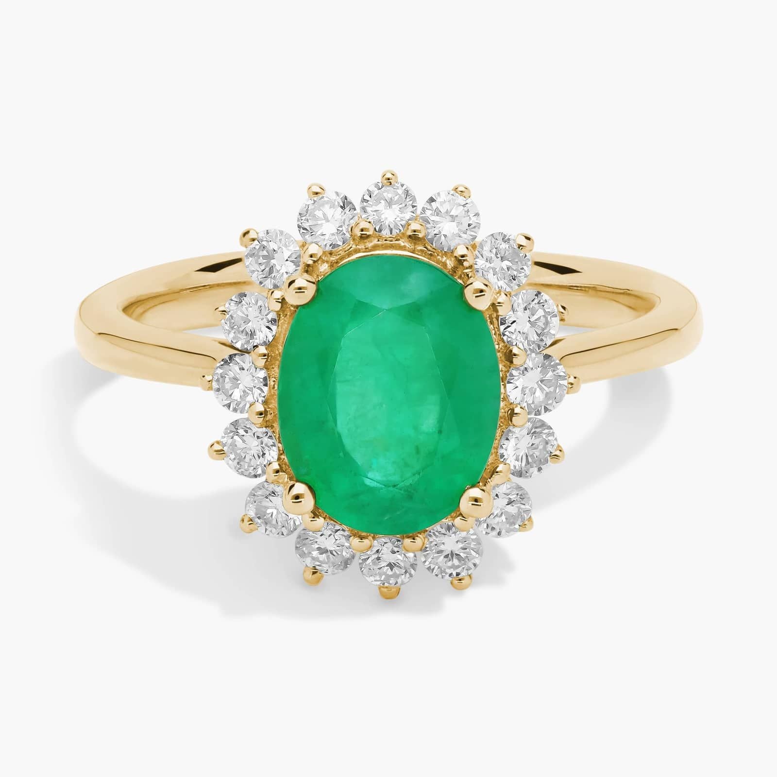 Oval Emerald and Diamond Sunburst Halo Ring in Yellow Gold