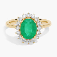 Oval Emerald and Diamond Sunburst Halo Ring in Yellow Gold