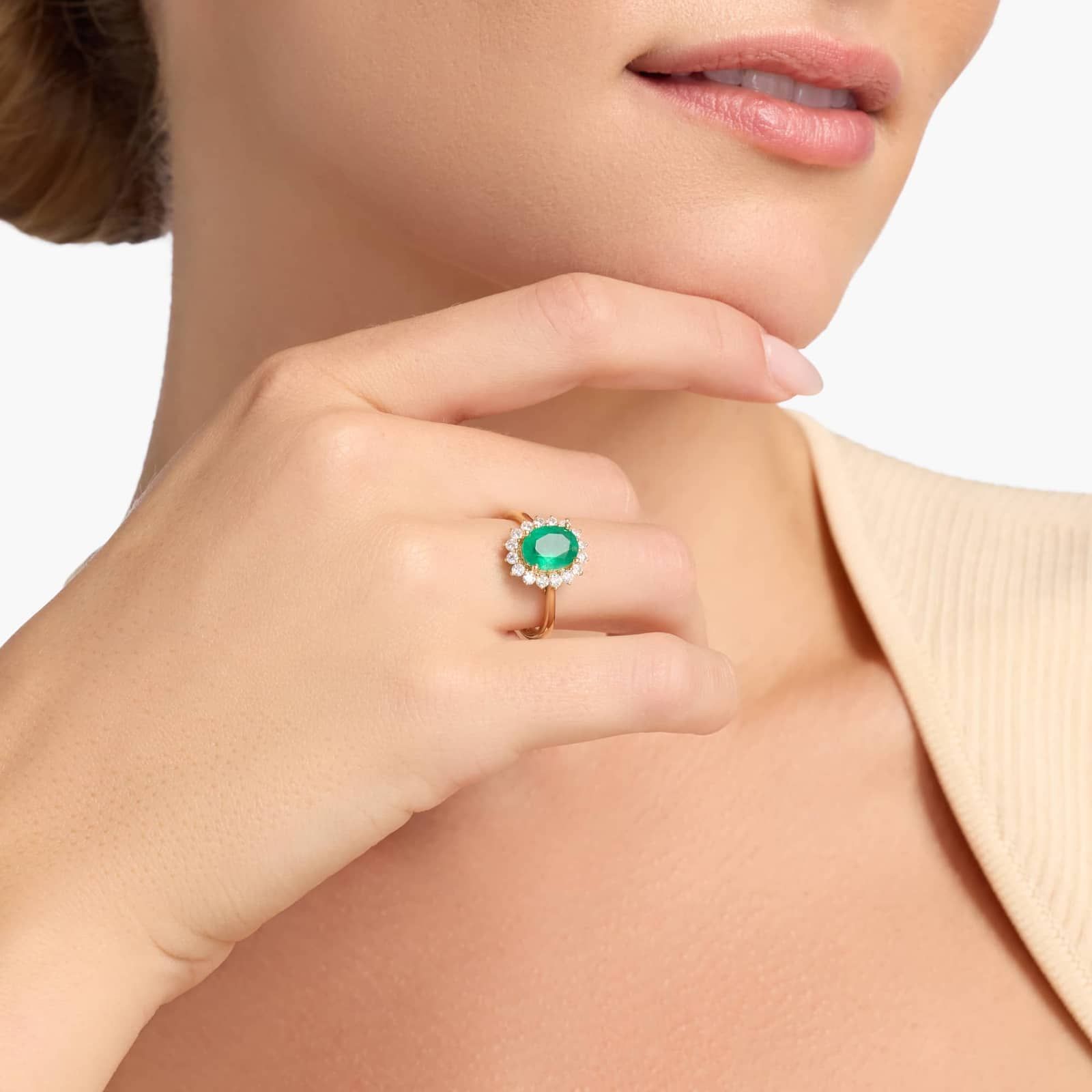 Oval Emerald and Diamond Sunburst Halo Ring in Yellow Gold
