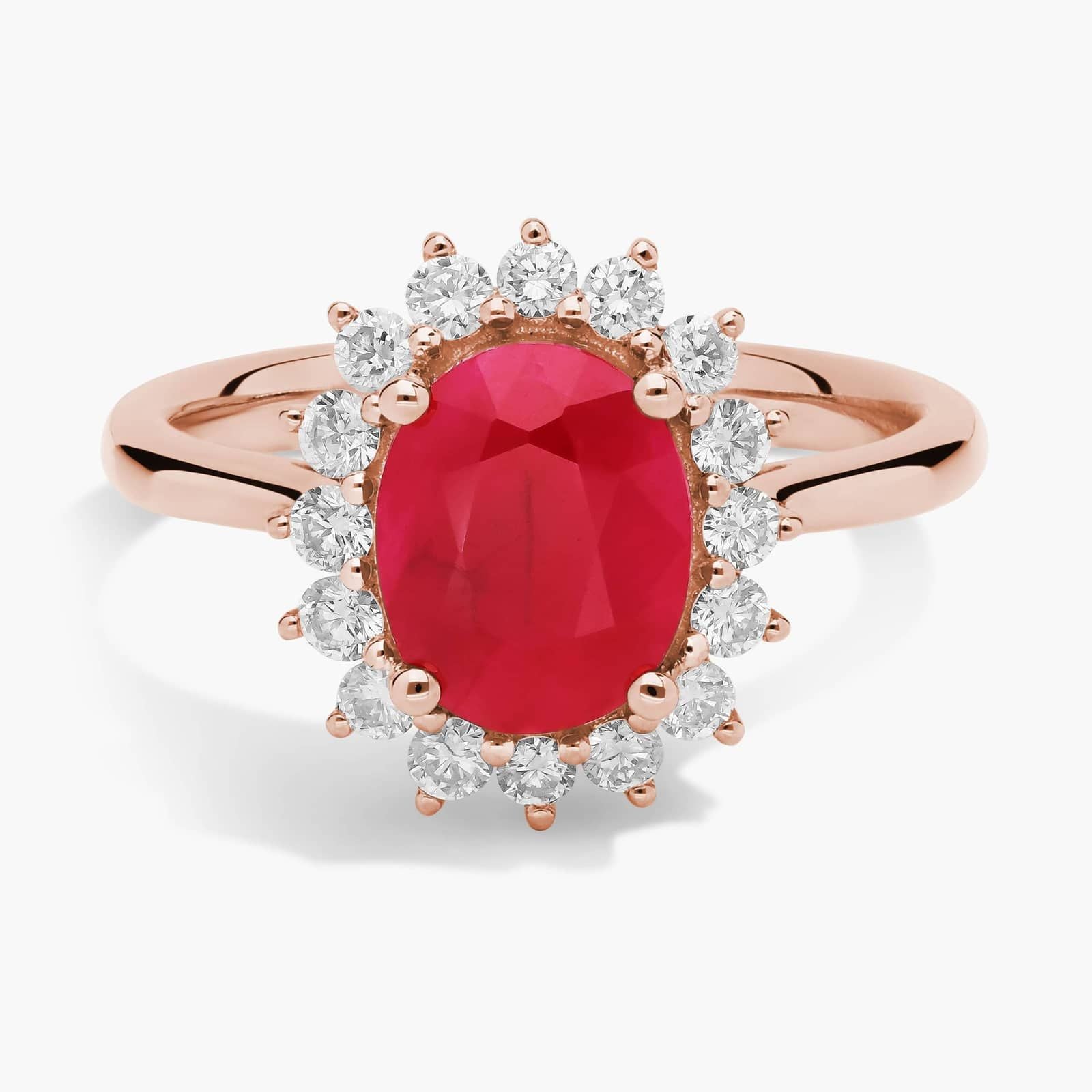 Oval Ruby and Diamond Sunburst Halo Ring in Rose Gold