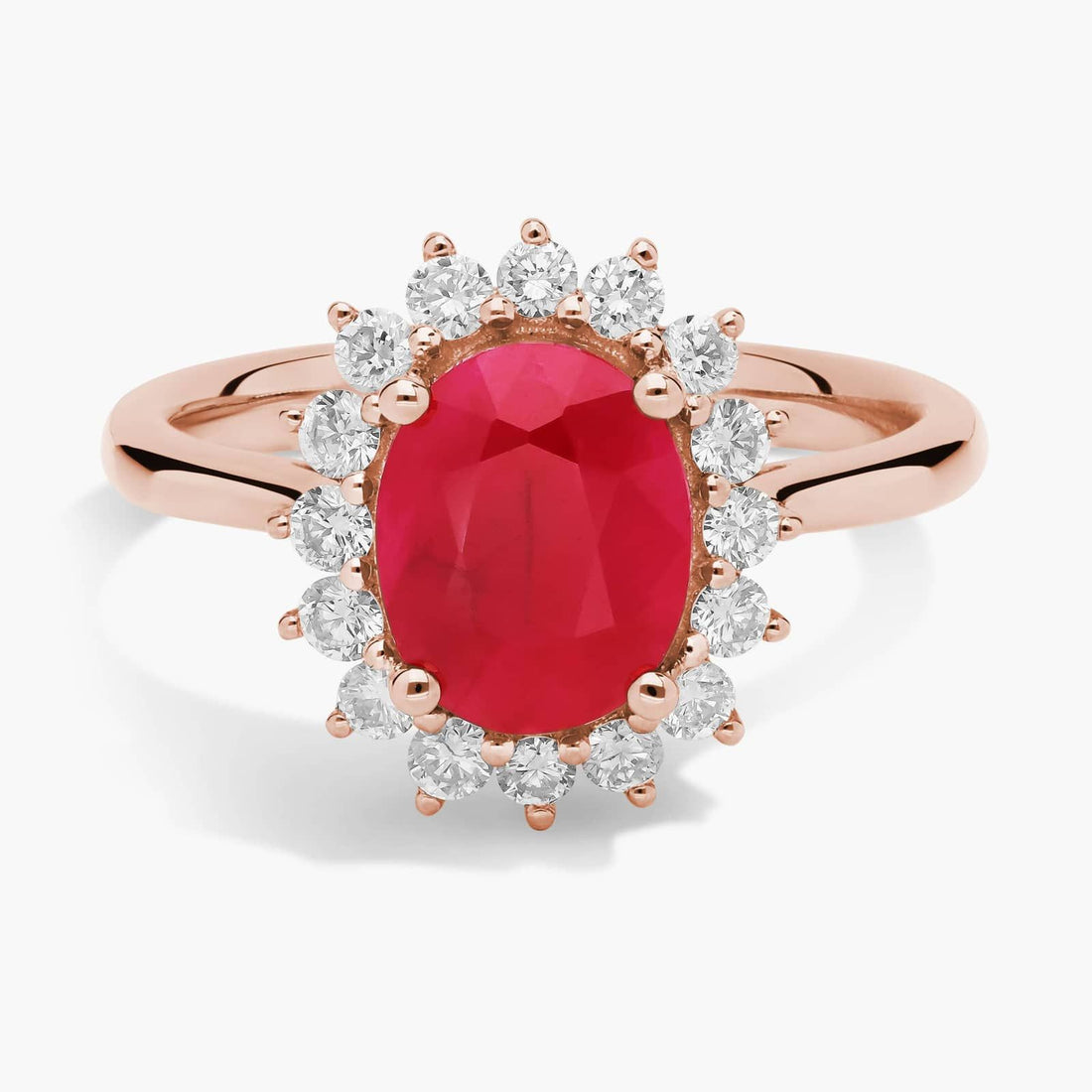 Oval Ruby and Diamond Sunburst Halo Ring in Rose Gold