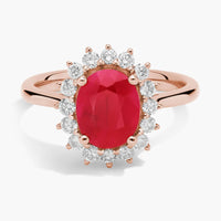 Oval Ruby and Diamond Sunburst Halo Ring in Rose Gold