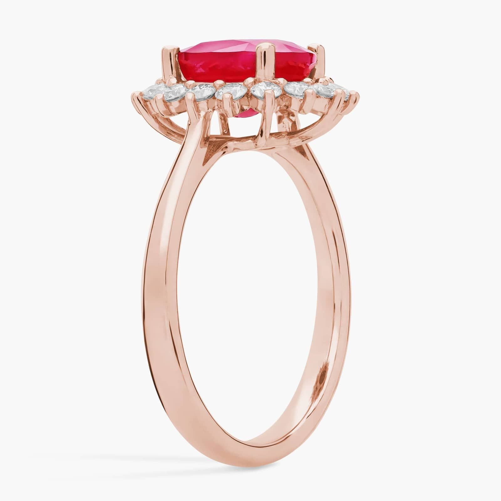 Oval Ruby and Diamond Sunburst Halo Ring in Rose Gold