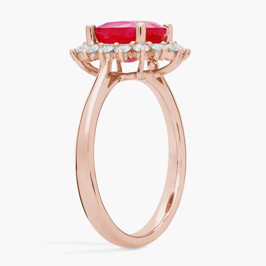 Oval Ruby and Diamond Sunburst Halo Ring in Rose Gold