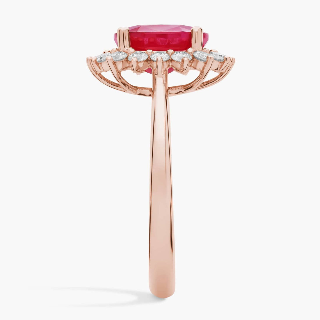 Oval Ruby and Diamond Sunburst Halo Ring in Rose Gold