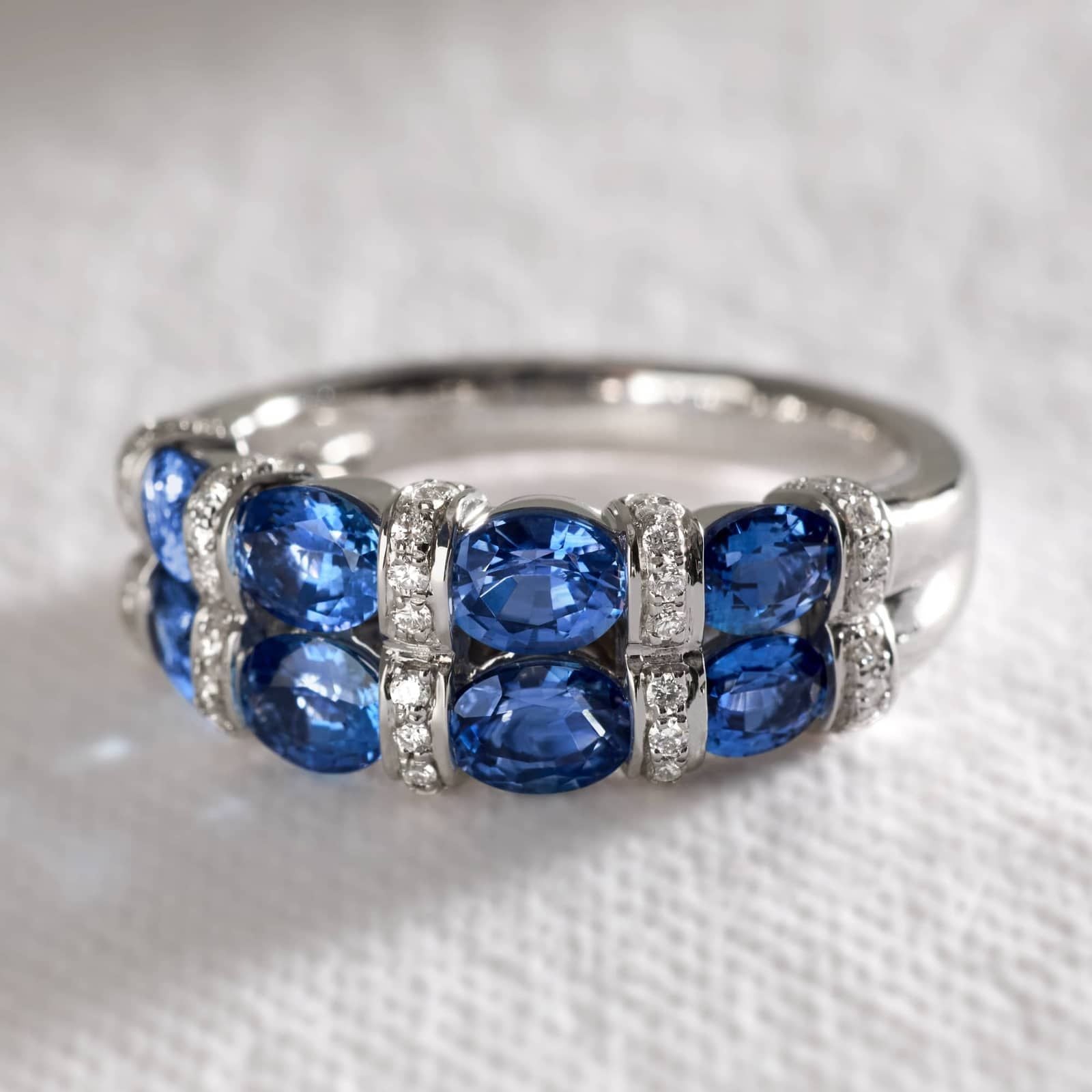 East-West Double Row Oval Cut Blue Sapphire and Pave Diamond Ring In White Gold / Yellow Gold