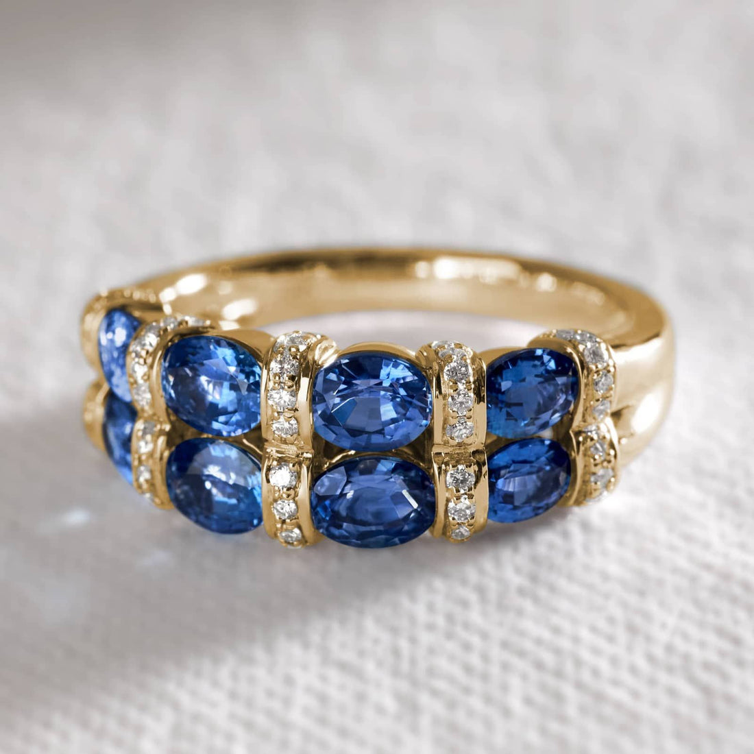 East-West Double Row Oval Cut Blue Sapphire and Pave Diamond Ring In White Gold / Yellow Gold