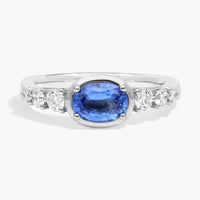 East-West Oval Cut Sapphire Ring With Half Bezel and Diamond Accent In White Gold / Yellow Gold